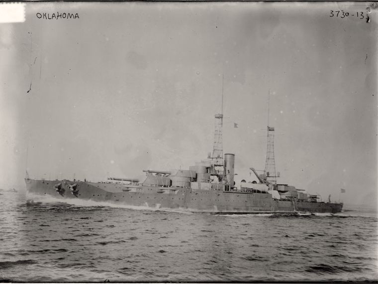 The battleship USS Oklahoma at sea, OKLAHOMA handwritten along the top edge. Library of Congress ggbain.20872.