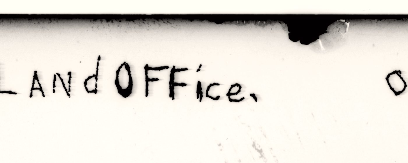 The handwritten caption LANdOFFice with a comma shaped mark after it, source of the comma, verified on the master scan